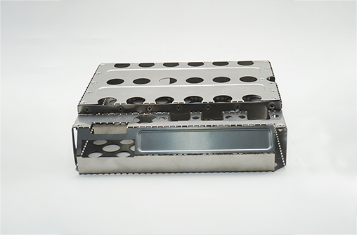 laser-cut and bent 304 stainless steel assembly with perforations, ribs and mounting studs