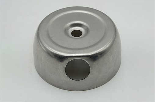 deep-drawn stainless steel cap, domed top with a centre hole